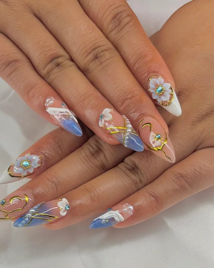 Detailed floral nail art created at Zilola
